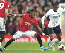  ?? AFP ?? Manchester United’s Fred, left, allowed Liverpool’s Georginio Wijnaldum to get the better of him in Sunday’s game