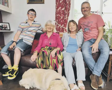  ??  ?? Helen Harber at home in Werrington with son Luke (15), fiancée Stephen, mum Shirley and dog Marley
