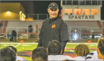  ?? JOHN DENNE/For the Taos News ?? Coach Art Abreu Jr. gives a victory speech on Friday (Sept. 23.)