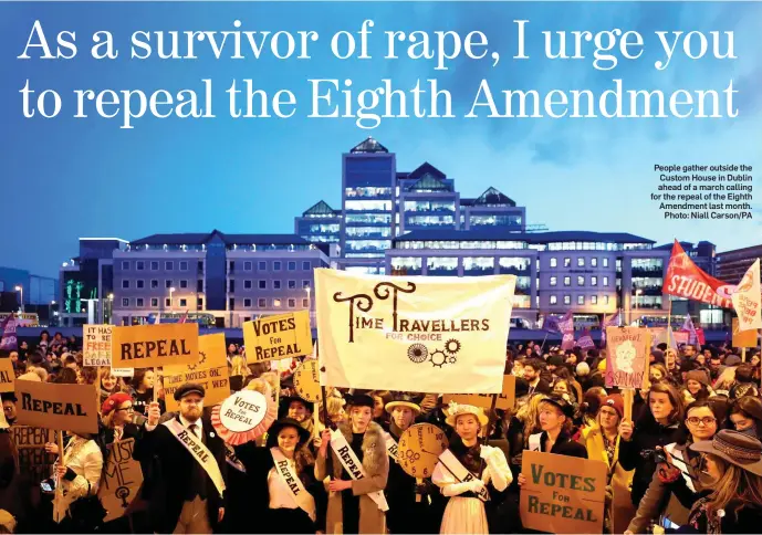  ??  ?? People gather outside the Custom House in Dublin ahead of a march calling for the repeal of the Eighth Amendment last month. Photo: Niall Carson/PA