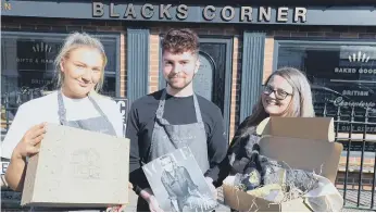  ??  ?? Blacks Corner Deli staff, from left, Elle Ramshaw, Nathan Bell and Lauren Gracie, with the hampers in the feature.