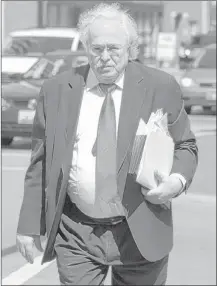  ?? | MATTHEW GROTTO~SUN-TIMES MEDIA ?? Dr. Michael Baden arrives at the Will County Courthouse on Wednesday.