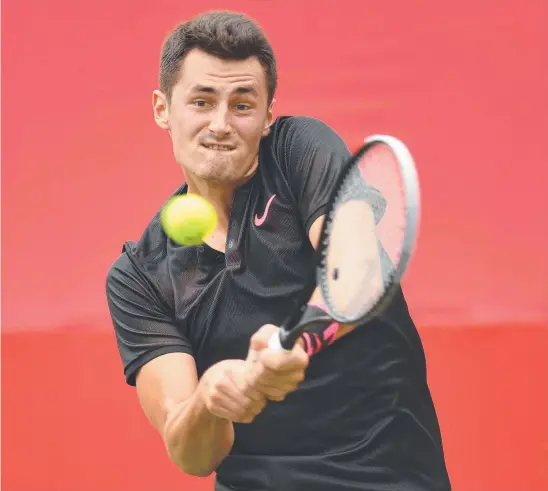  ?? Picture: GETTY IMAGES ?? Bernard Tomic plays a backhand on his way to victory against Joao Sousa, of Portugal, in Tokyo yesterday,