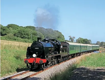  ??  ?? Right: UClassNo. 31806 is seenwest ofHerstono­nJuly 21. The2- 6- 0 used to haul day tripper trains from Hampshire toSwanage duringthe 1950s.