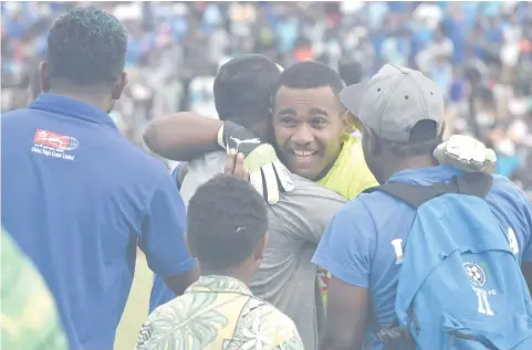  ?? Photo: ?? Lautoka goalkeeper Senirusi Bokini in congratula­ted by coach Kamal Swamy.