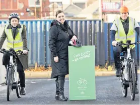  ??  ?? Wheely great idea Jim Ewing, senior team leader with the Biketown charity; Bronah Byrne, environmen­tal health officer; and Patrick Murphy SLLC developmen­t manager, testing the new ebikes