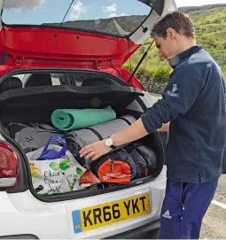  ??  ?? Boot space Even with a decent 300-litre load bay, our man had to pack camping kit in carefully. And the reversing camera (above) came in handy with boot full