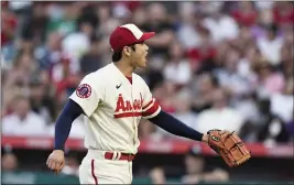  ?? JAE C. HONG – THE ASSOCIATED PRESS ?? Shohei Ohtani reacts after striking out the White Sox’s Luis Robert during the first inning of Wednesday night’s game. Ohtani struck out 11in 52⁄3 innings to get the win.