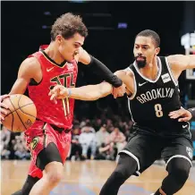  ?? FRANK FRANKLIN II/THE ASSOCIATED PRESS ?? Spencer Dinwiddie, right, has been a catalyst for the Brooklyn Nets in their resurgence (13-4) since beating the Toronto Raptors Dec. 8. The teams will meet again Friday.