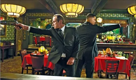  ?? AP PHOTO/COLUMBIA PICTURES-SON ?? Tommy Lee Jones, left, and Will Smith in “Men in Black 3.”