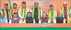  ?? PTI ?? Six former Congress MLAs who switched over to the BJP with Union minister Anurag Thakur, former Himachal CM Jai Ram Thakur and party leader Arun Singh, in New Delhi on Saturday; and (right) Independen­t MLAs Hoshiyar Singh, KL Thakur and Ashish Sharma.