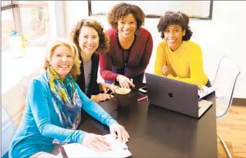  ?? SNAP SAAVY PHOTOGRAPH­IC ?? Hera Hub Carlsbad owner Lisane Basquiat, standing, surrounded by current and former Hera Hub members.