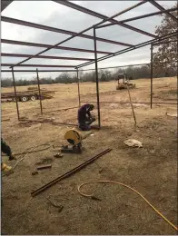  ?? James Lockhart photo ?? Building a tin barn.