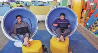  ?? BLOOMBERG ?? Employees sit in ball chairs as they work on laptop computers at the Flipkart Online Services Pvt headquarte­rs in Bengaluru,