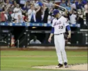  ?? FRANK FRANKLIN II — THE ASSOCIATED PRESS ?? New York Mets starting pitcher Matt Harvey (33) reacts after Chicago Cubs’ Kyle Schwarber hit a two-pprun home run during the fourth inning of a baseball game Wednesday in New York.