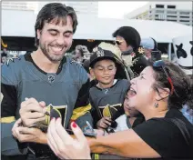  ?? Richard Brian ?? Las Vegas Review-journal @vegasphoto­graph Right wing Alex Tuch, signing autographs in September at a fan event, has agreed to a seven-year deal with Knights.