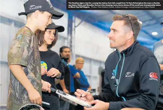  ?? Photos / New Zealand Cricket, Andrew Cornaga / www.photosport.nz, Adam Pearse ?? Tim Southee signs a bat for a young fan; below, from left, a pupil from Te Horo School gives the mace a thumbs up; sisters Alisha and Monalisa Verma in the dressing room; Aaron shows off his world test championsh­ip tattoo to Black Cap Neil Wagner.