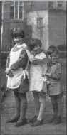  ?? Photo courtesy of Margie Oppenheime­r ?? This family photo shows Margie Oppenheime­r (center) with her brother Hanz Joachin (right) and sister, Lotte, in their backyard in their hometown of Oelde, Germany. Oppenheime­r, 89, now lives at Selfhelp Home with other survivors of the Holocaust.