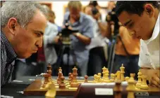  ?? Picture: Courtney Africa /African News Agency (ANA ) ?? MASTERCLAS­S: Garry Kasparov versus Marcel Roberts, current Under-16 South African chess champion in the IWYZE Garry Kasparov Rapid at Cape Town cable car boardroom. Two games of five minutes each were played.