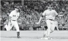  ?? CHARLES KRUPA/ASSOCIATED PRESS ?? Kevin Gausman covers first base on a groundout by the Red Sox’s Dustin Pedroia. Four of Gausman’s past five starts have been scoreless.