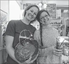  ?? ROSALIE MACEACHERN PHOTO ?? Owner Carey Allan, left, and friend Christy Toone at Perfect Diversity where you can try your hand at a potter’s wheel, paint plates, cups and bowls or just come in for the French press tea and coffee.