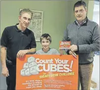  ?? SUBMITTED PHOTO ?? A young patient and his father receive informatio­n about Count Your Cubes at the Belvedere Dental Clinic. From left are Ross Burton, Colton Burton and Dr. Mike Connolly.