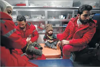  ?? Picture: AFP/ ABDULMONAM EASSA ?? MOVING OUT: Syrian Red Cross staff help relocate patients yesterday