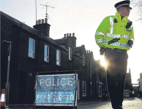  ??  ?? Police at the scene of the ATM raid in Kirriemuir.