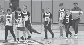  ?? KURT SNYDER/THE ADVOCATE ?? Johnstown honors its recreation and select youth boys basketball teams at halftime of a junior varsity game. The Johnstown programs are thriving but will need to find space at additional facilities to grow.