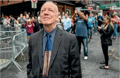  ?? AP ?? James McGlynn looks towards the One World Trade Centre site on the anniversar­y of the 9/11 terrorist attacks in New York, wearing a tie bearing the likeness of the original World Trade Centre towers.