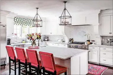  ?? BOB GREENSPAN/TRIBUNE NEWS SERVICE ?? The open-concept kitchen tugged at the homebuyer’s heart the most. She imagined it filled with light, color and family.