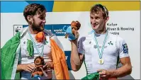  ??  ?? GOLDEN: Paul (left) and Gary O’Donovan celebrate their world title victory