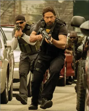  ??  ?? Maurice Compte as Benny and Gerard Butler as Big Nick in Den of Thieves