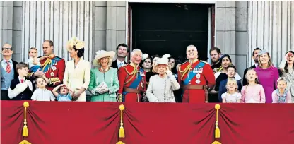  ??  ?? Forty-four members of the Royal family packed on to the balcony of Buckingham Palace to watch the fly-past, including the Duchess of Sussex, right, who made a brief return from maternity leave. The Duchess of Cambridge held on to Prince Louis, who was dressed in an almost identical outfit to the one worn by the Duke of Sussex in 1986, below left