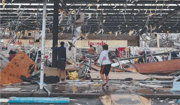  ?? Picture: GETTY/AFP ?? A store in Panama City stands in tatters after Hurricane Michael ripped through the Florida Panhandle.