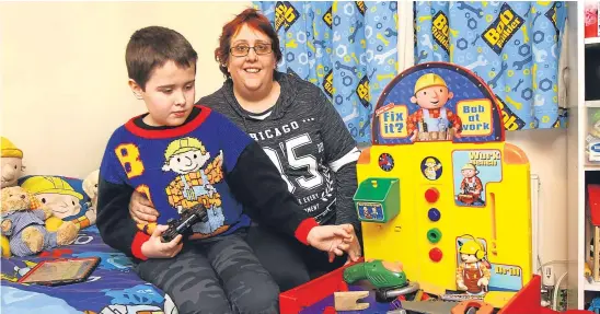  ?? Picture: Dougie Nicolson. ?? Cam with mum Farrah and the Bob the Builder workbench he wanted for Christmas.