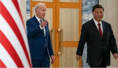  ?? ?? U.S. President Joe Biden, left, arrives with Chinese President Xi Jinping for a meeting on the sidelines of the G20 summit meeting. AP Photo/Alex Brandon