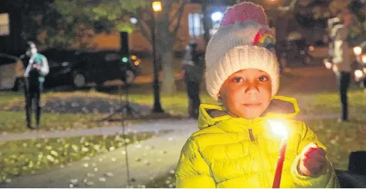  ?? DANIEL BROWN/LOCAL JOURNALISM INITIATIVE REPORTER ?? Arianna Eriavbe-Wolters, 5, was one of about a hundred people who attended an End SARS vigil Friday in Charlottet­own.