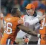  ?? ASSOCIATED PRESS FILE ?? Clemson coach Dabo Swinney congratula­tes his players during the ACC championsh­ip game last year.