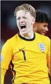  ??  ?? England’s goalkeeper Jordan Pickford celebrates his side’s 2-1 win at the end of the Euro 2020 soccer championsh­ip semifinal match between England and Denmark at Wembley stadium in London. (AP)