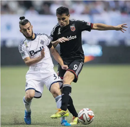  ?? — CP FILES ?? Vancouver Whitecaps’ Russell Teibert, left, and former D.C. United striker Fabian Espindola battle for the ball during a 2014 game at B.C. Place. The Whitecaps acquired Espindola last week, but then turned around and transferre­d his rights to a Mexican...