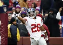 ?? PATRICK SEMANSKY - THE ASSOCIATED PRESS ?? New York Giants running back Saquon Barkley (26) celebrates his 78-yard touchdown during the first half of an NFL football game against the Washington Redskins, Sunday, Dec. 9, 2018, in Landover, Md.