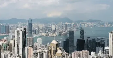  ?? BILLY H.C. KWOK / BLOOMBERG ?? Hong Kong kept its top spot on the Bloomberg Global City Housing Cost Index, a ranking of the 100 most expensive municipali­ties in which to live. Vancouver moved up 16 spots to place 16th, Toronto jumped 18 spots to place 28th.
