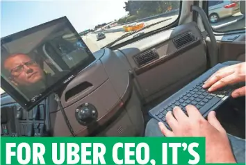  ?? TONY AVELAR, AP ?? Jacob Larry of Otto checks on software of a self-driving, big-rig truck in San Francisco. Uber is acquiring the start-up, which has developed technology allowing big rigs to drive themselves.