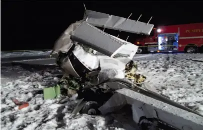  ?? CP PHOTO ?? Emergency services attend to a plane crash near La Crete, Alta., early Sunday. Two seperate plane crashes on the Prairies have claimed two lives.