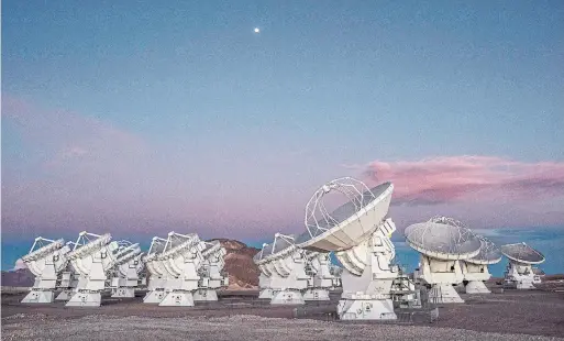  ?? TOMAS MUNITA THE NEW YORK TIMES ?? Reservatio­ns are tough to get at the Atacama Large Millimeter/submillime­ter Array (ALMA) in the Atacama Desert in Chile, which has the feeling of a space colony.