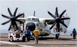  ??  ?? The C-2 Greyhound that brought Vayu to and from the carrier being towed
                                                                                        