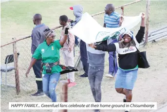  ?? ?? HAPPY FAMILY... Greenfuel fans celebrate at their home ground in Chisumbanj­e