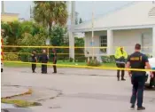  ?? —AP ?? Emergency responders at the scene of a shooting at the Victory City Church in Riviera Beach.