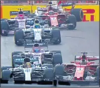  ??  ?? WHEEL TO WHEEL: Hamilton and Vettel clash